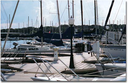 Sailboats docked in slips on Lake Travis at Cypress Creek Marina